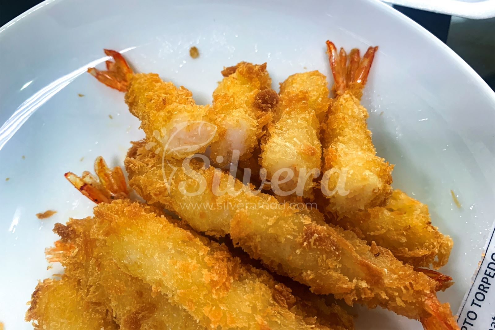 Taste test on fried breaded torpedo shrimps