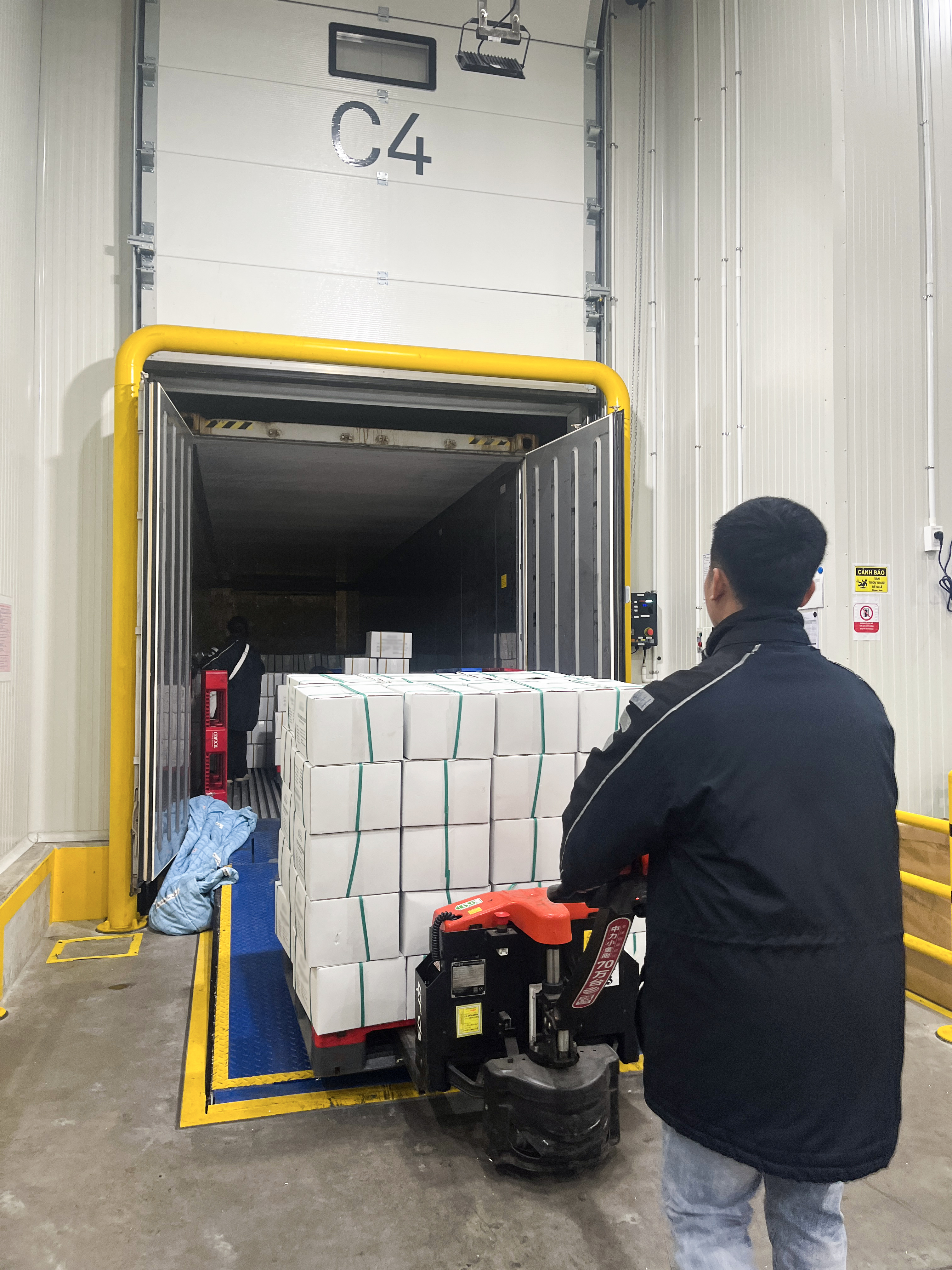 Loading goods into container in Vietnam