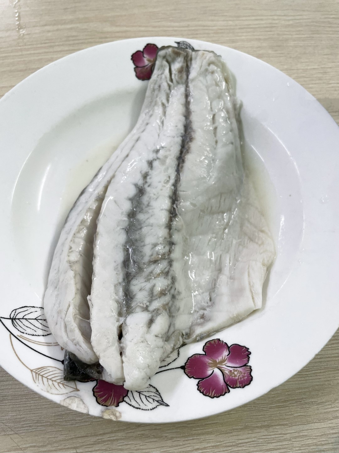 Cooked barramundi fillet skin on
