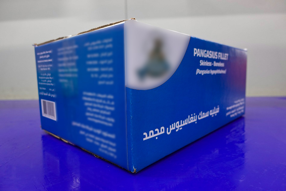 Pangasius fillets on trays packed into a carton